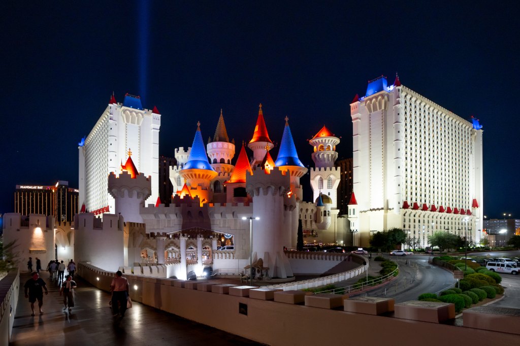 Exterior view of the Excalibur Hotel and Casino, a large white castle with colorful towers, in Las Vegas, Nevada on September 24, 2024.